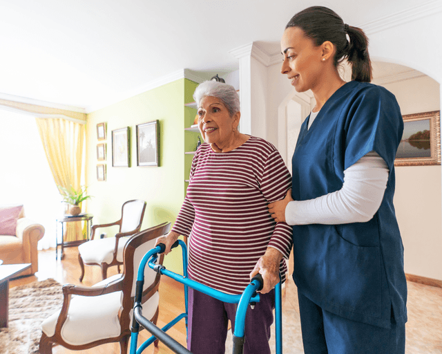 Caregiver helping an elderly person with daily activities